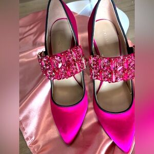 Slip on dress pump with jewel embellished elastic vamp, stiletto heel.